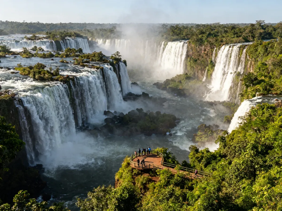 Panoramic view of Iguazu Falls surrounded by rainforest