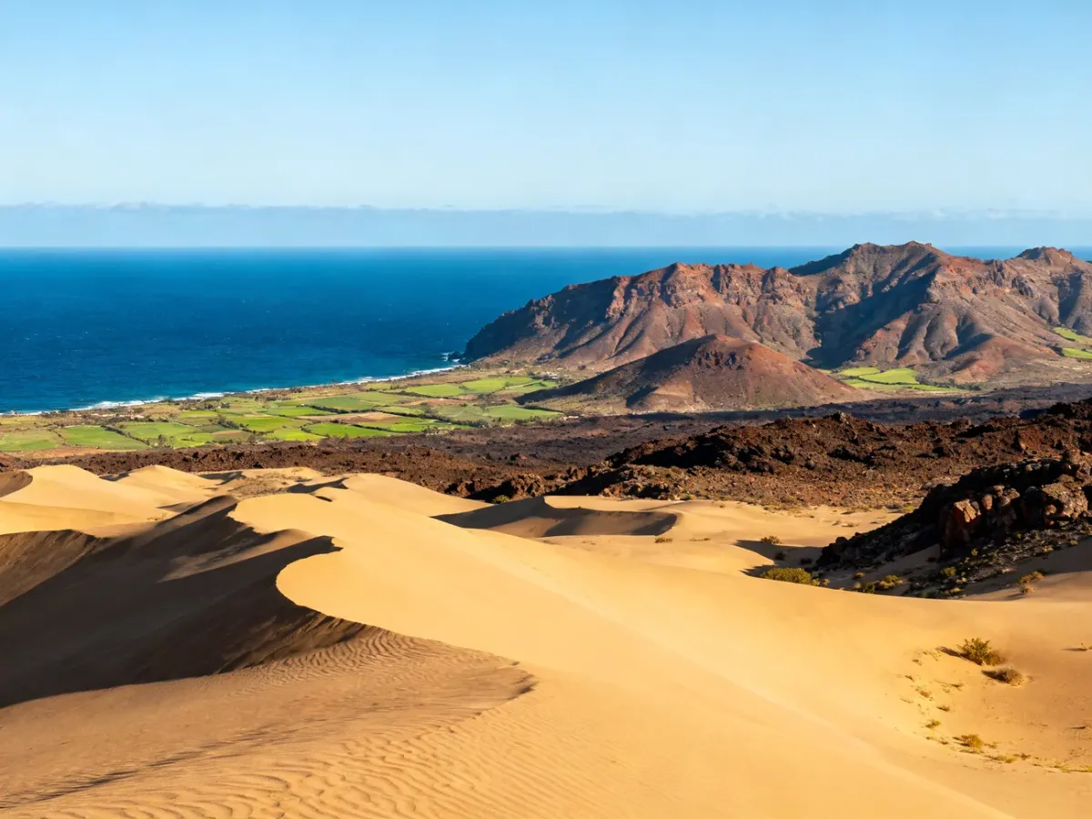 Panoramic view of Gran Canaria with Maspalomas dunes, ocean and volcanic mountains