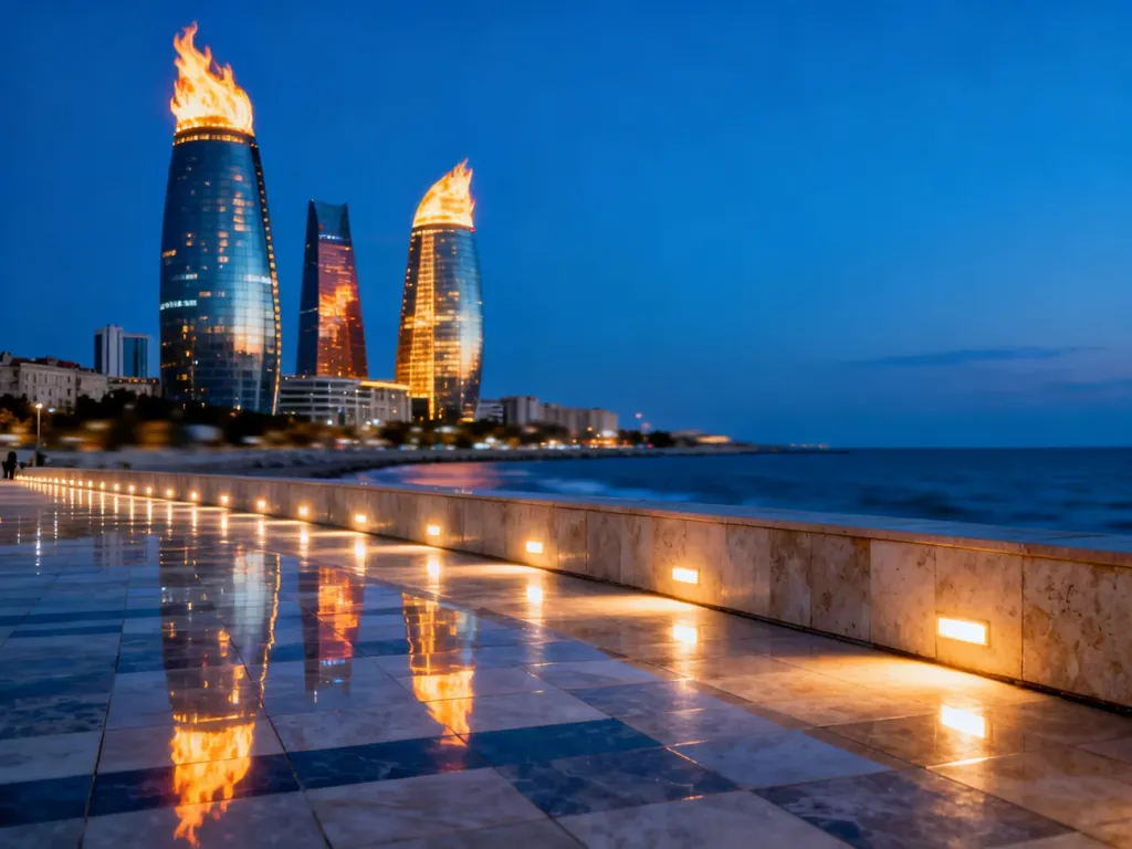 Wieżowce Flame Towers w Baku oświetlone nocą, górujące nad nowoczesną promenadą z widokiem na Morze Kaspijskie.